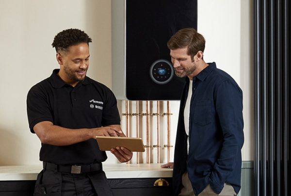 Installer Talking to Customer About a Boiler